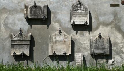 wall with tombstones embedded in it